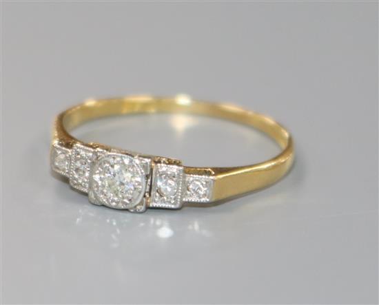 A 1920s/1930s 18ct gold, platinum and stepped graduated five stone diamond ring, size Q.
